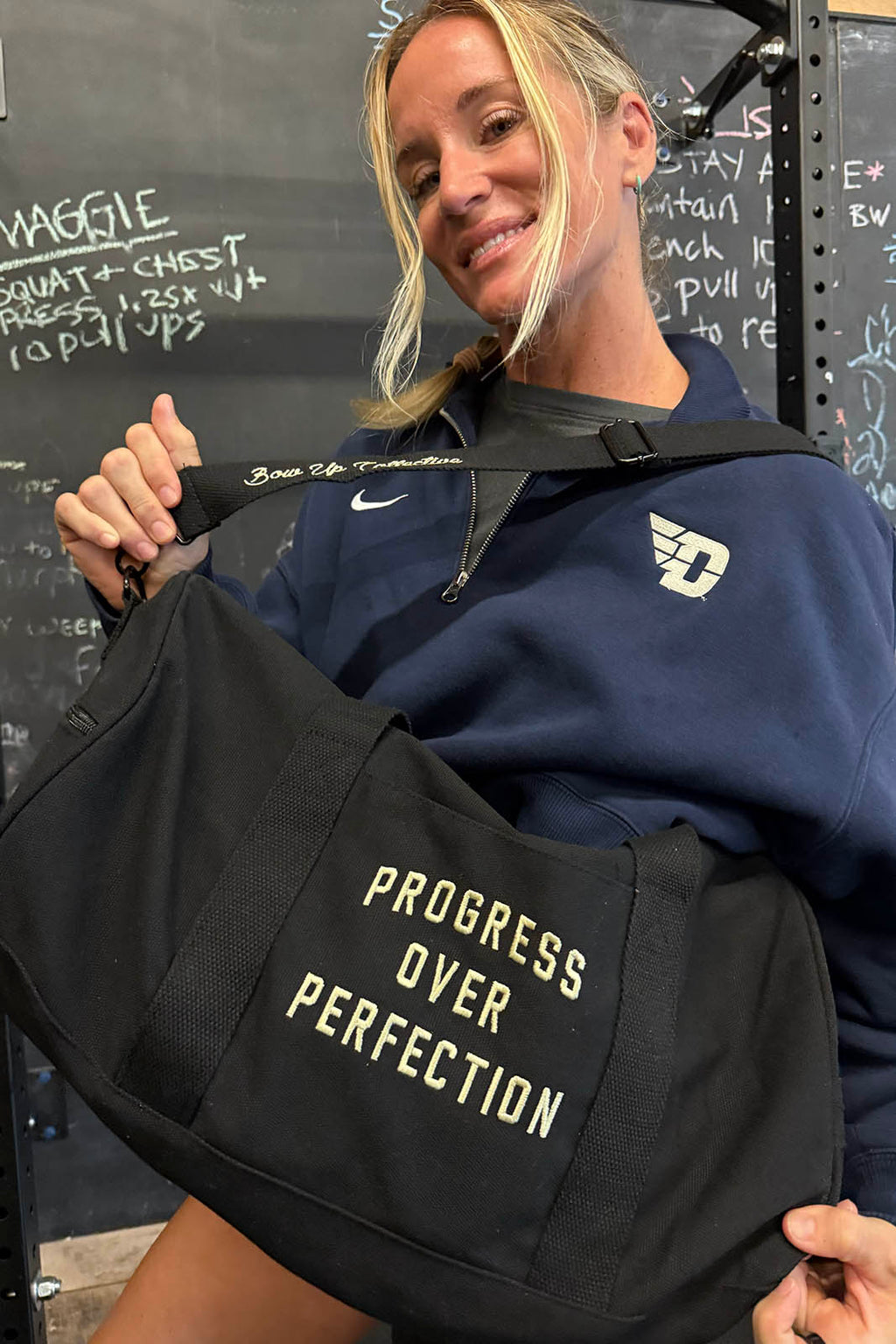 Progress over perfection duffel bag
